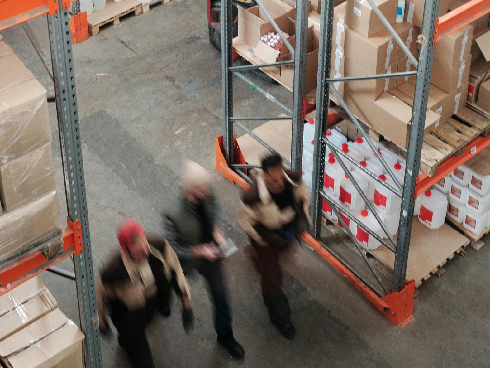 Warehouse aisle with packed goods and logistics racks